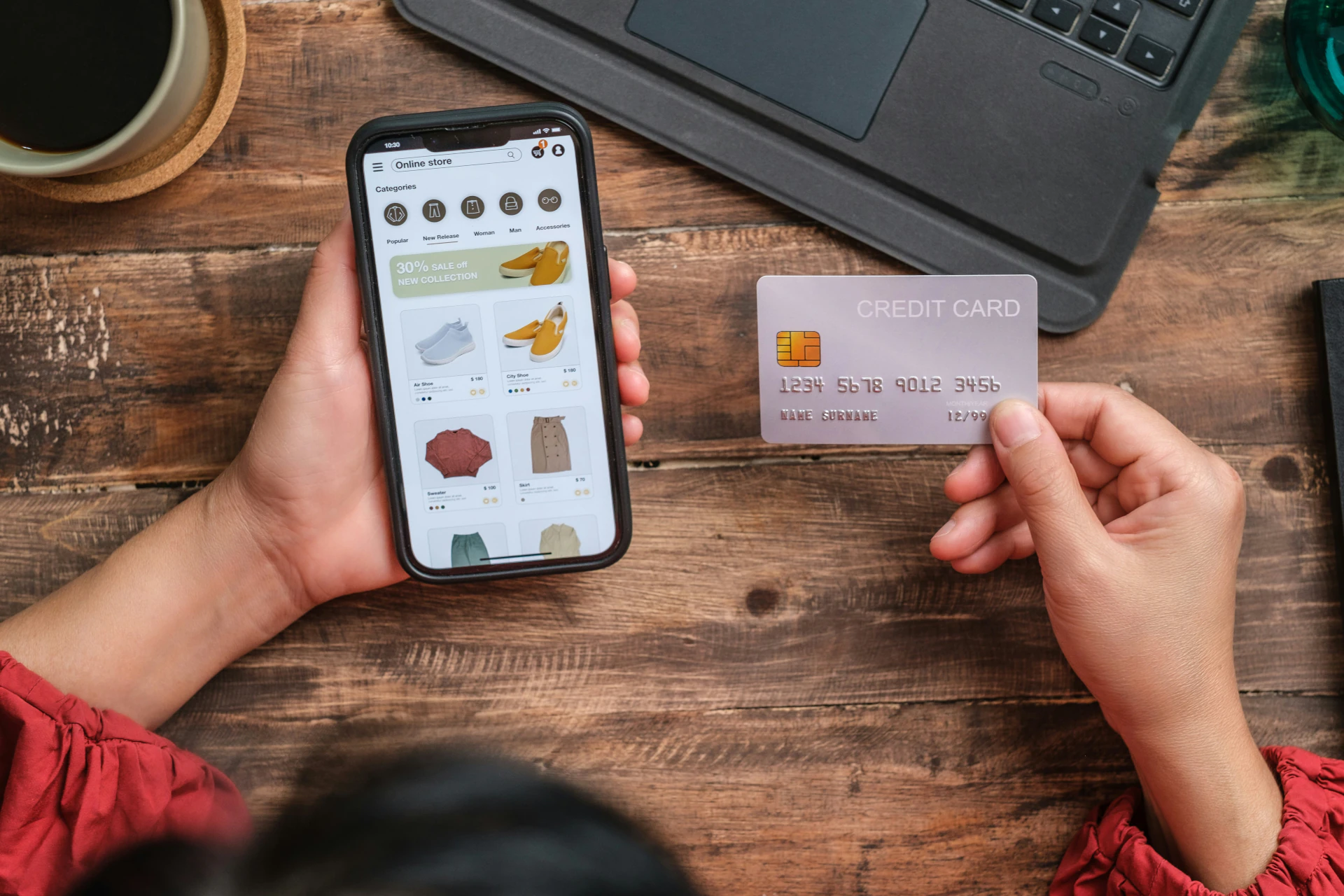 Girl holding smartphone and credit card for eCommerce purchase.