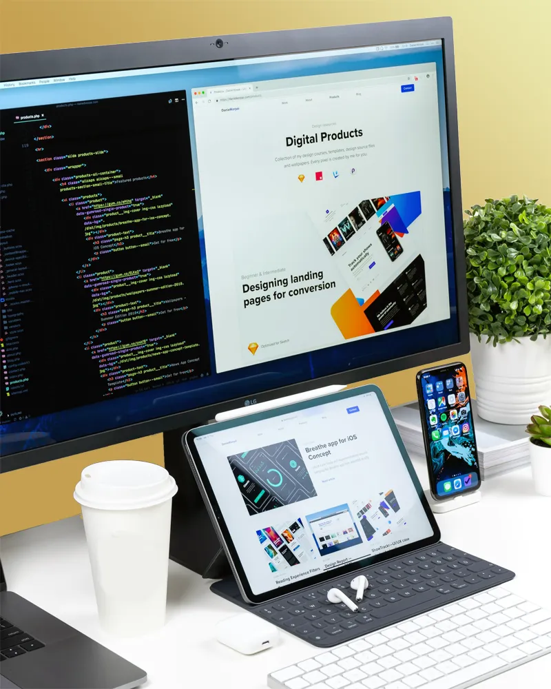 Computer, Laptop, and phone displaying website and code