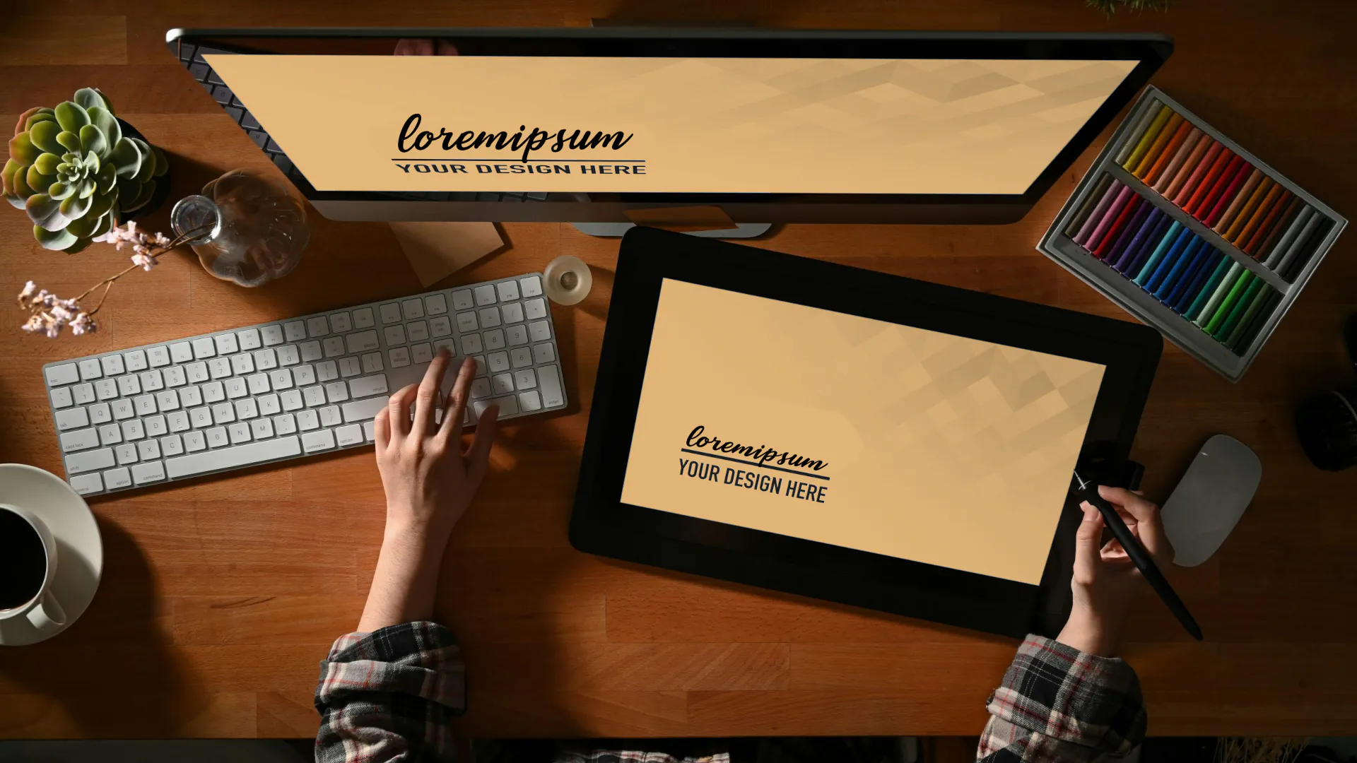 Top down view of desk with monitor, laptop, and tablet showing web design element.